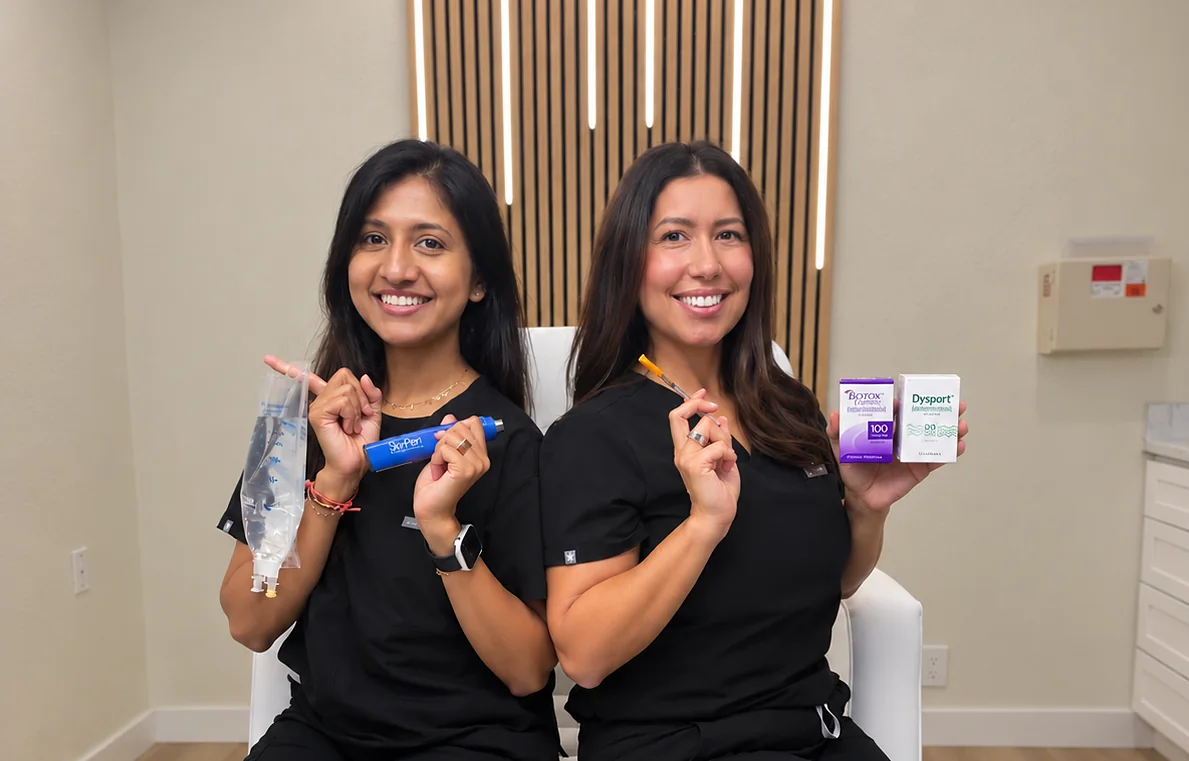 Ria Jivan, BSN, RN holding an IV hydration bag, seated with Kia Brooks, RN